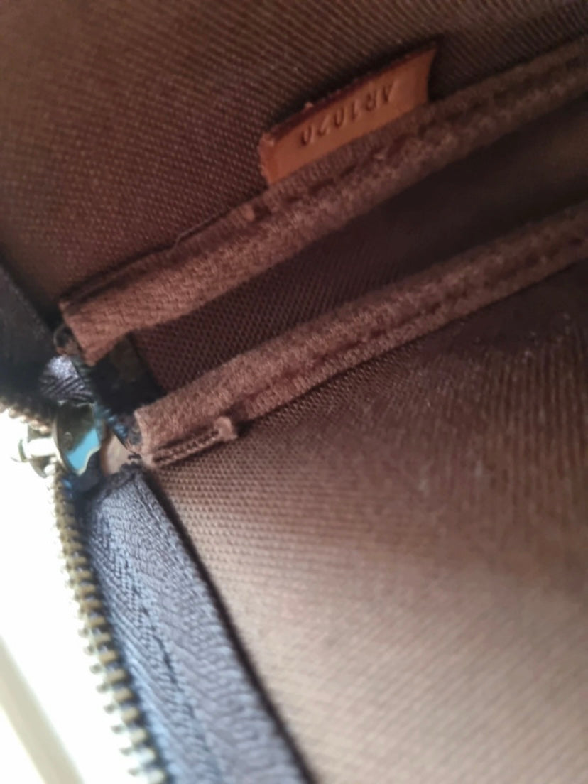 Louis Vuitton classic monogram accessory clutch bag
