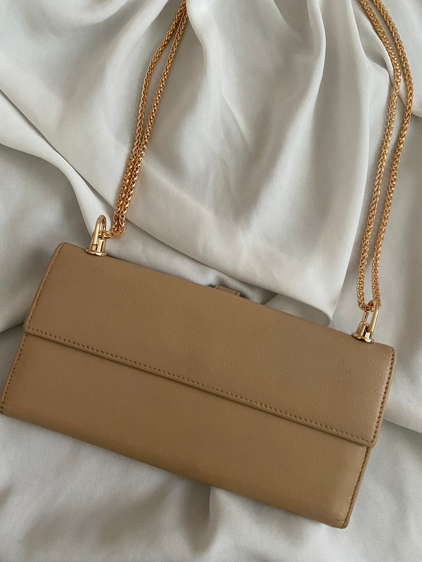 Gucci monogram clutch bag in sand