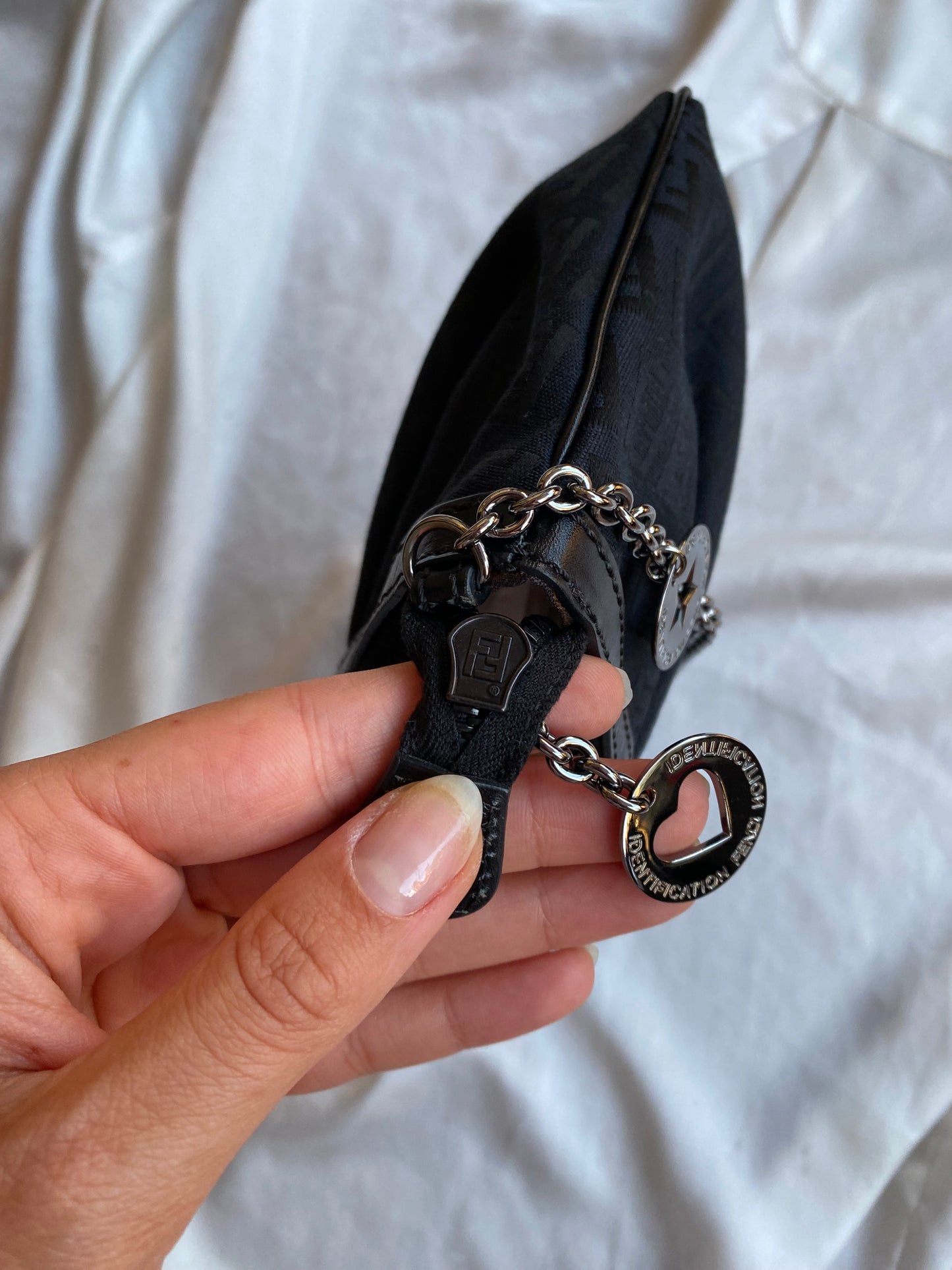 Fendi clutch bag with silver monogram charms and zucchini