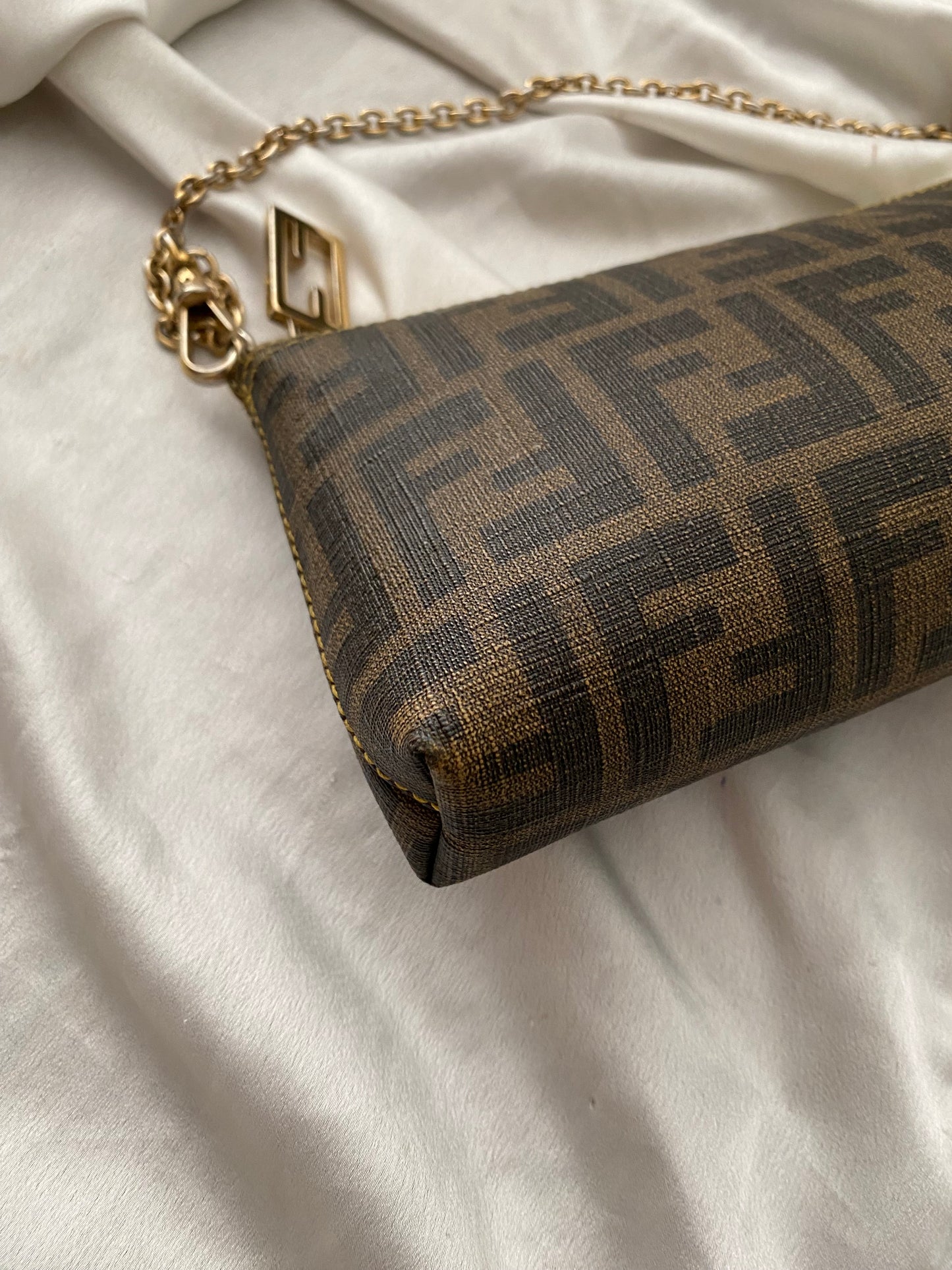 Fendi monogram clutch bag in pumpkin, tobacco, and yellow