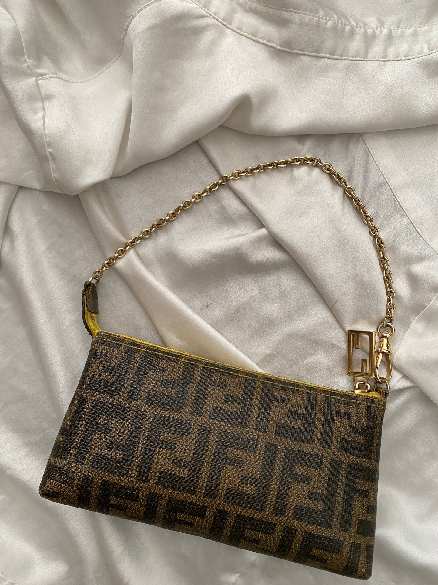 Fendi monogram clutch bag in pumpkin, tobacco, and yellow