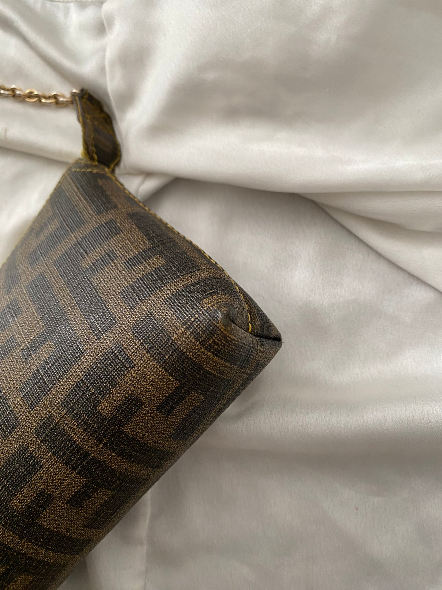 Fendi monogram clutch bag in pumpkin, tobacco, and yellow