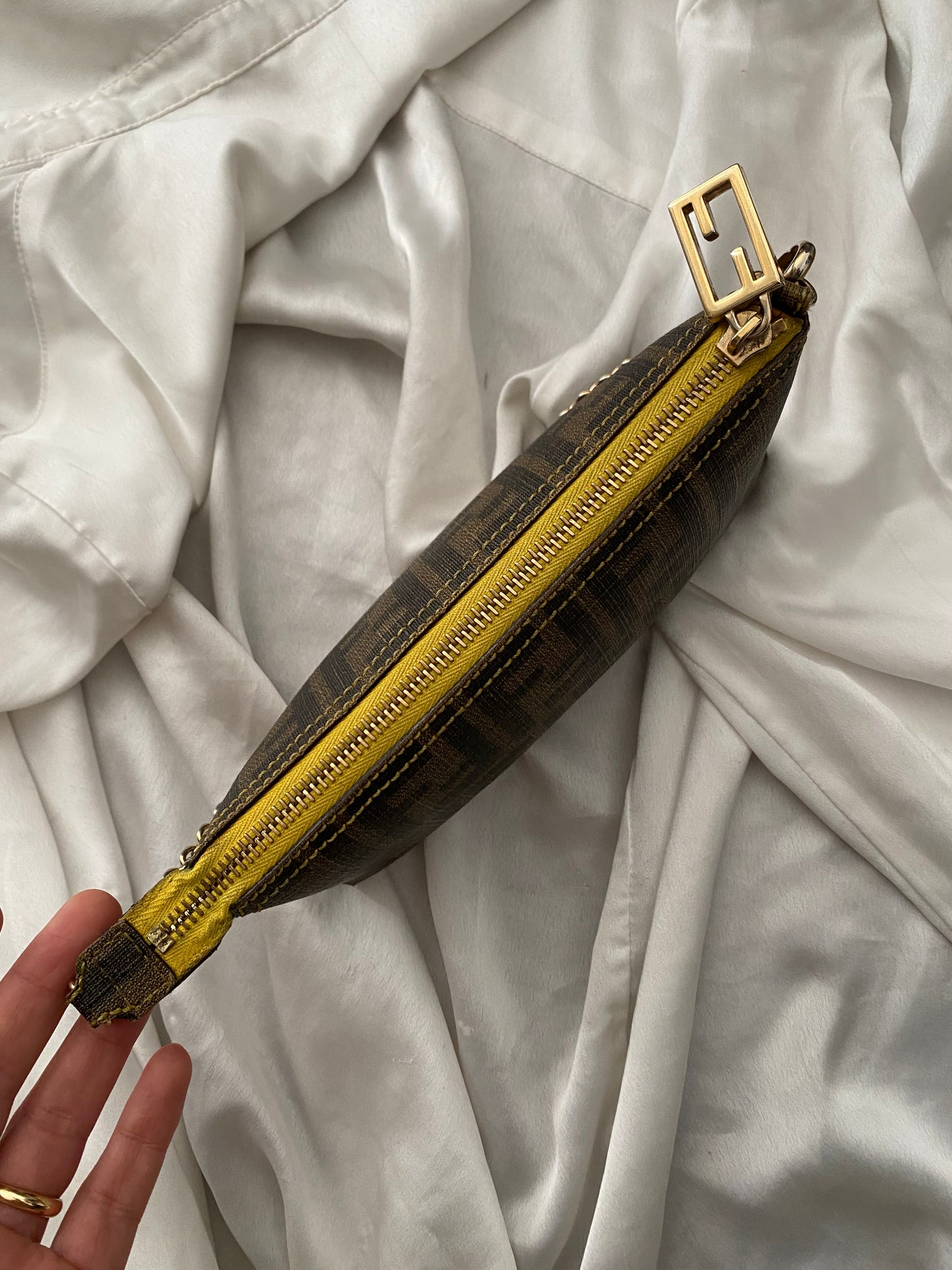 Fendi monogram clutch bag in pumpkin, tobacco, and yellow
