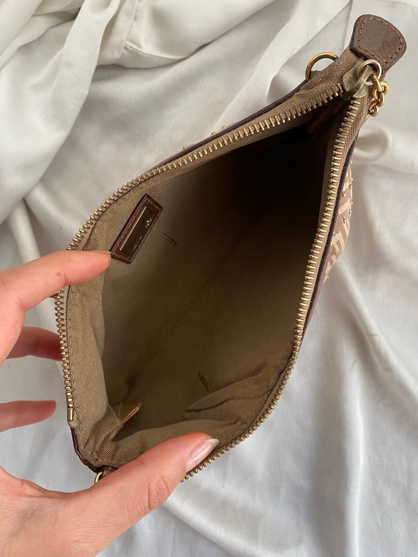 Fendi clutch bag with gold charms and beige zucchini monogram