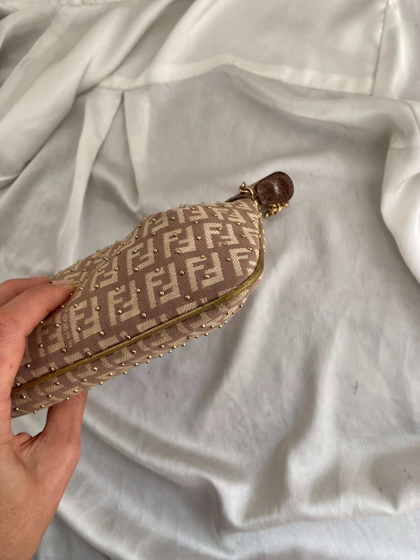 Fendi clutch bag with gold charms and beige zucchini monogram