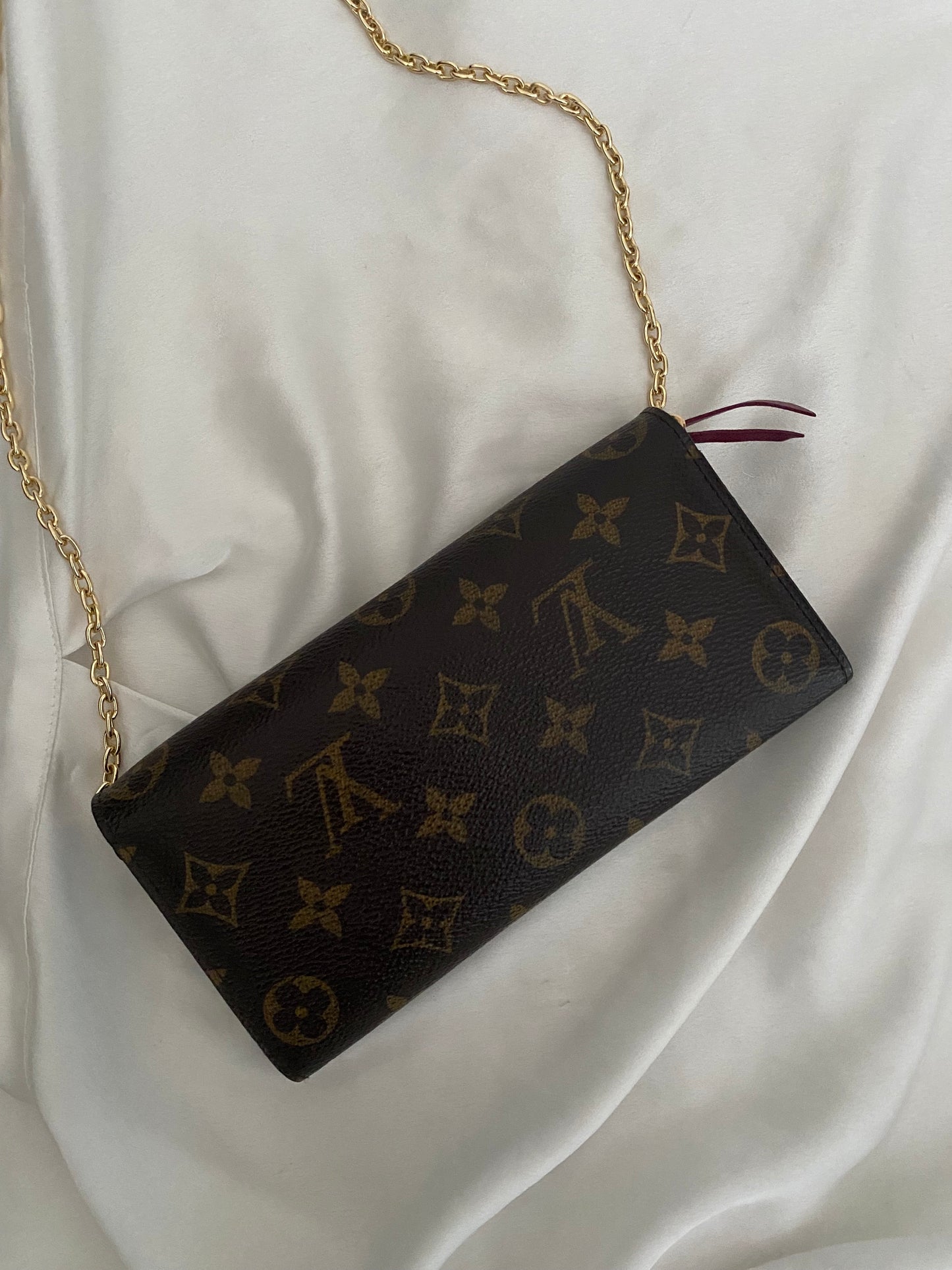 Louis Vuitton Emilie clutch bag with fuchsia interior