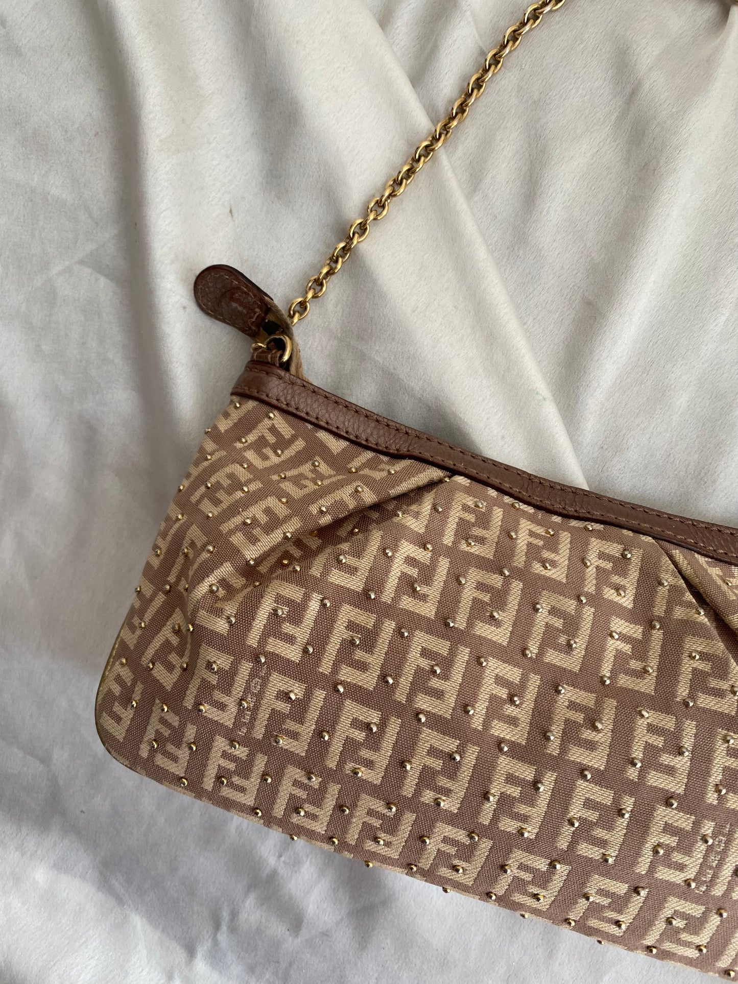 Fendi clutch bag with gold charms and beige zucchini monogram