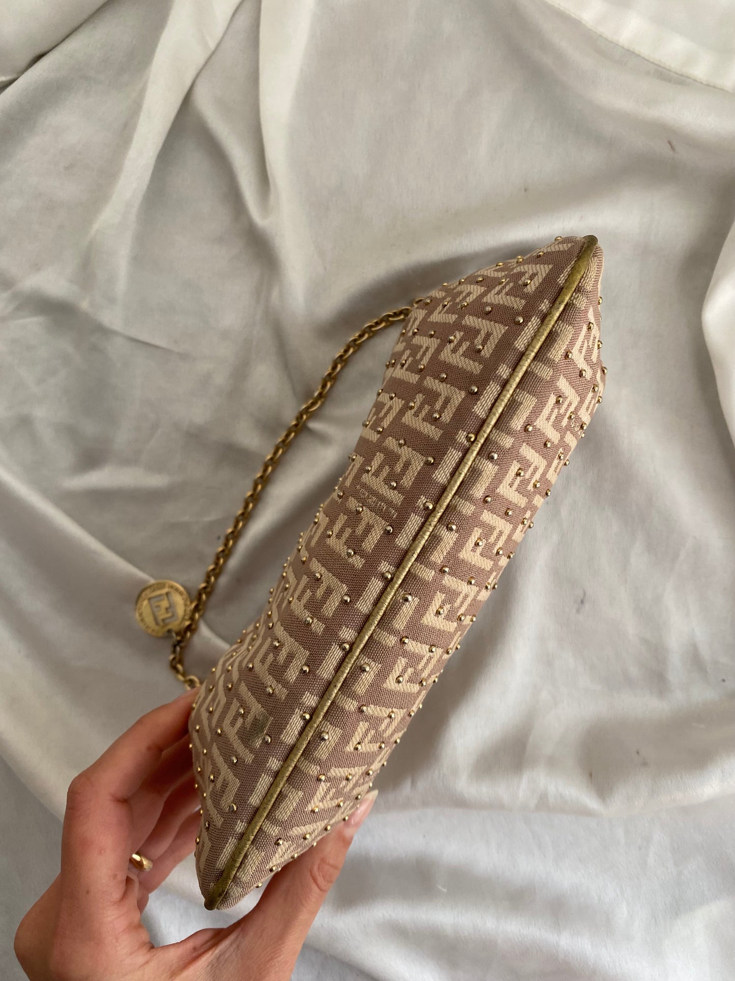 Fendi clutch bag with gold charms and beige zucchini monogram