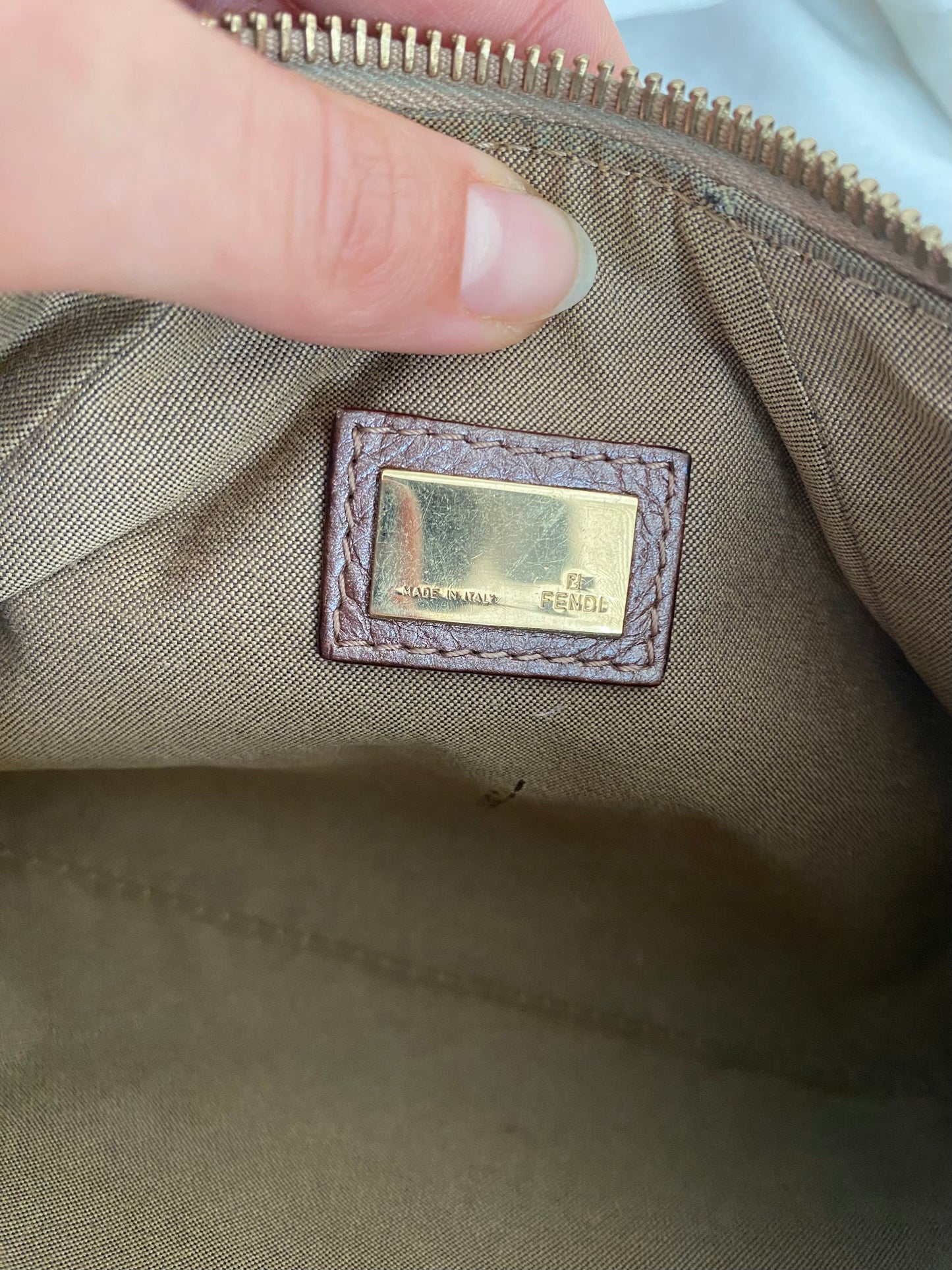 Fendi clutch bag with gold charms and beige zucchini monogram