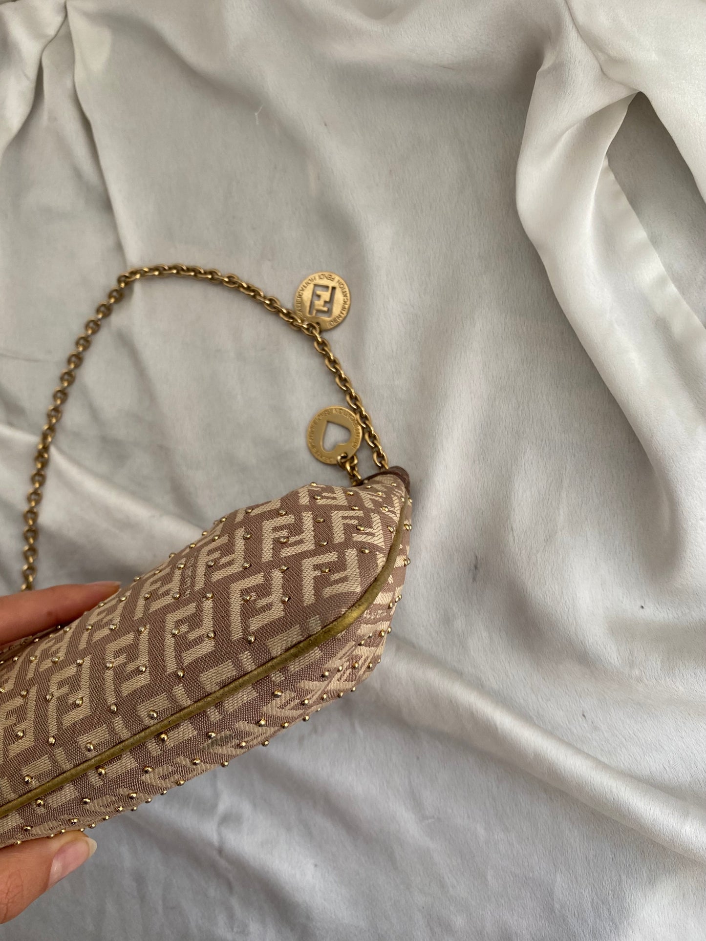 Fendi clutch bag with gold charms and beige zucchini monogram