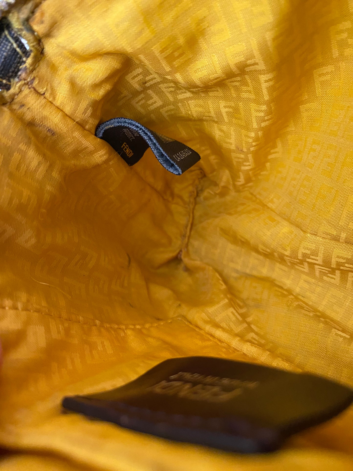 Fendi monogram clutch bag in pumpkin, tobacco, and yellow