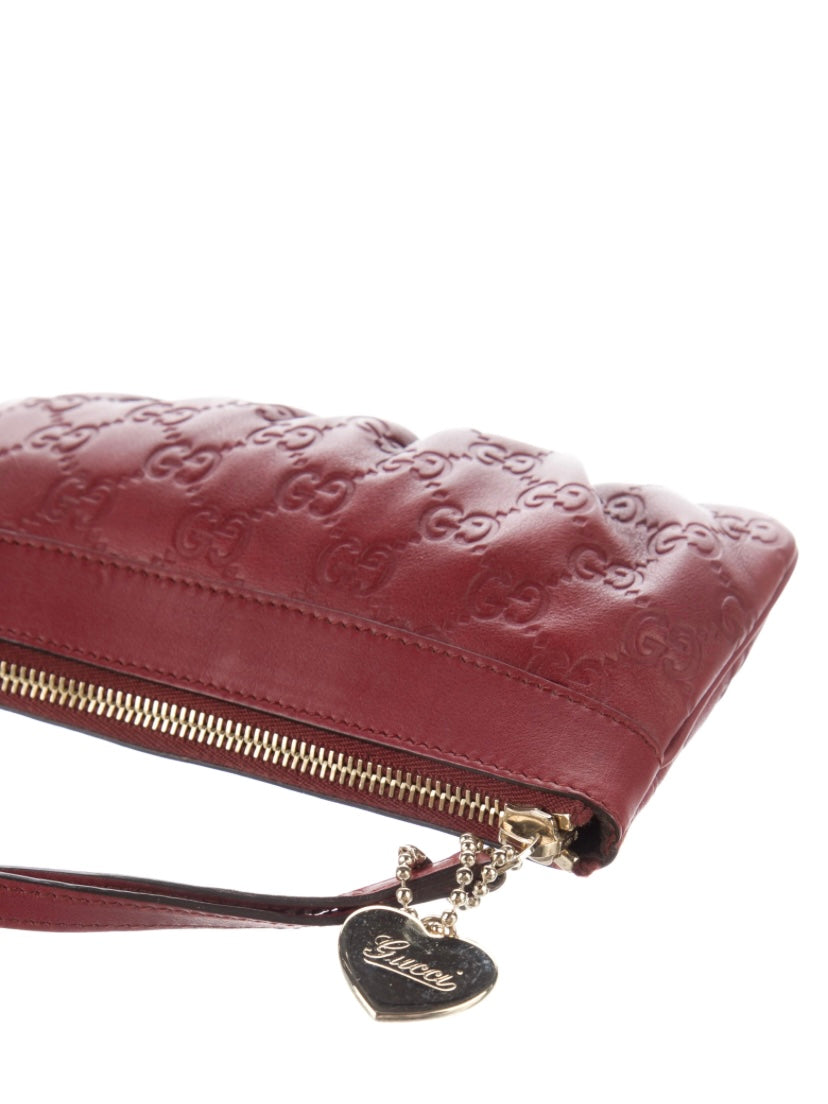 Gucci Monogram burgundy leather clutch bag