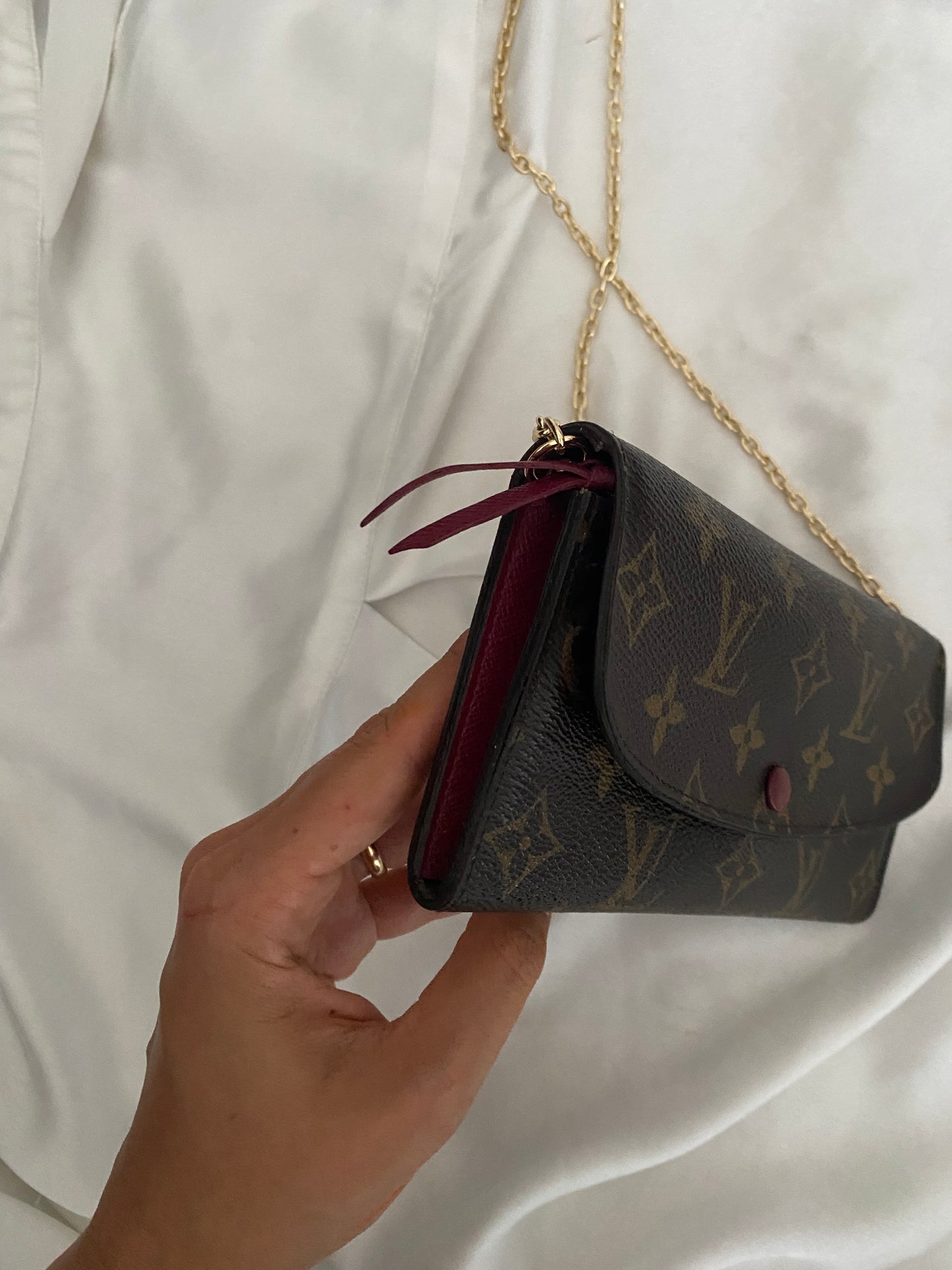 Louis Vuitton Emilie clutch bag with fuchsia interior