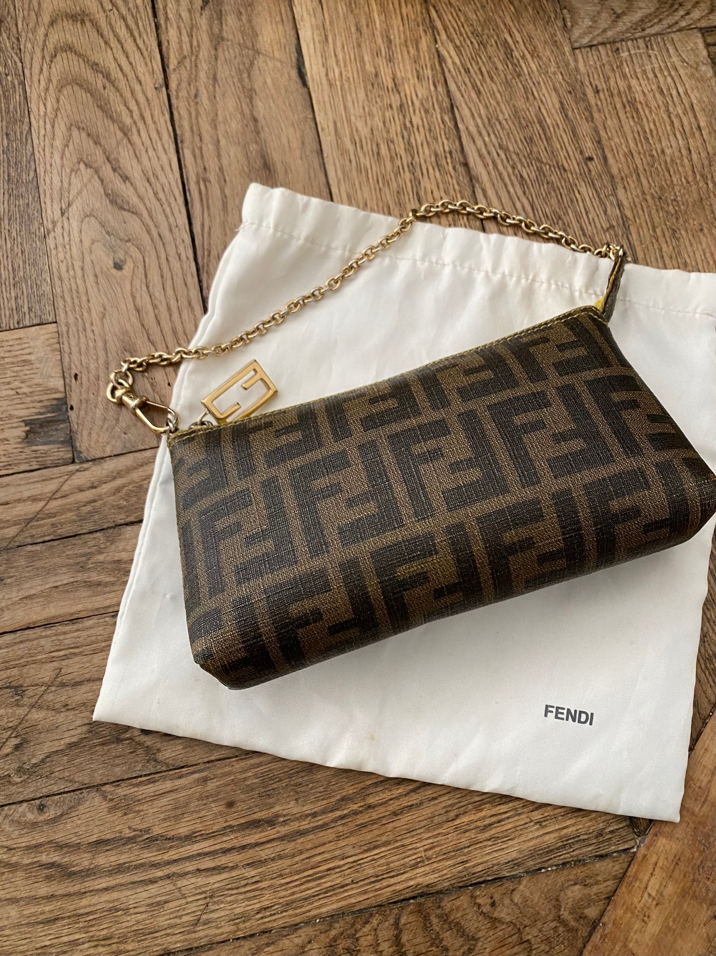 Fendi monogram clutch bag in pumpkin, tobacco, and yellow