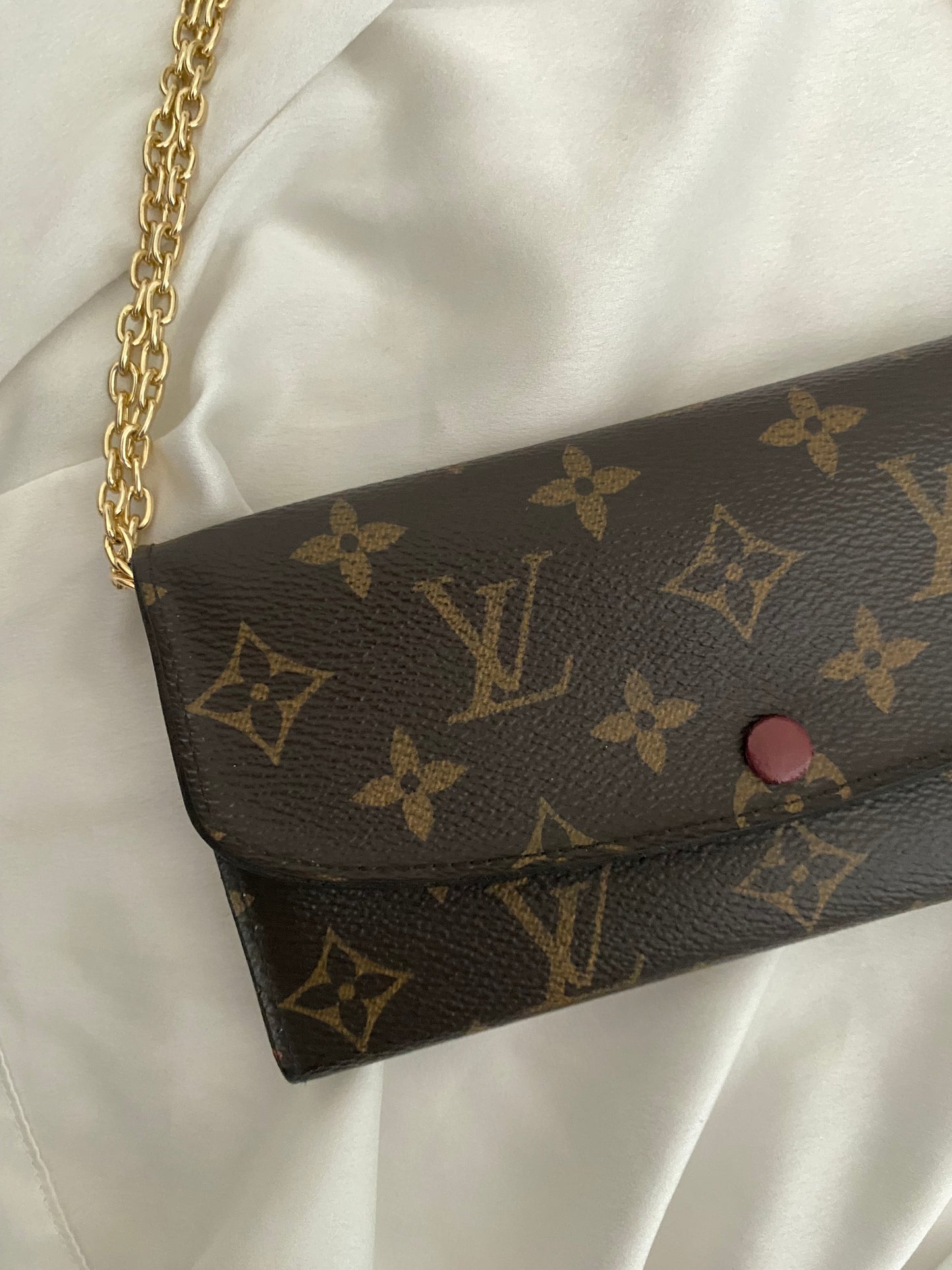 Louis Vuitton Emilie clutch bag with fuchsia interior