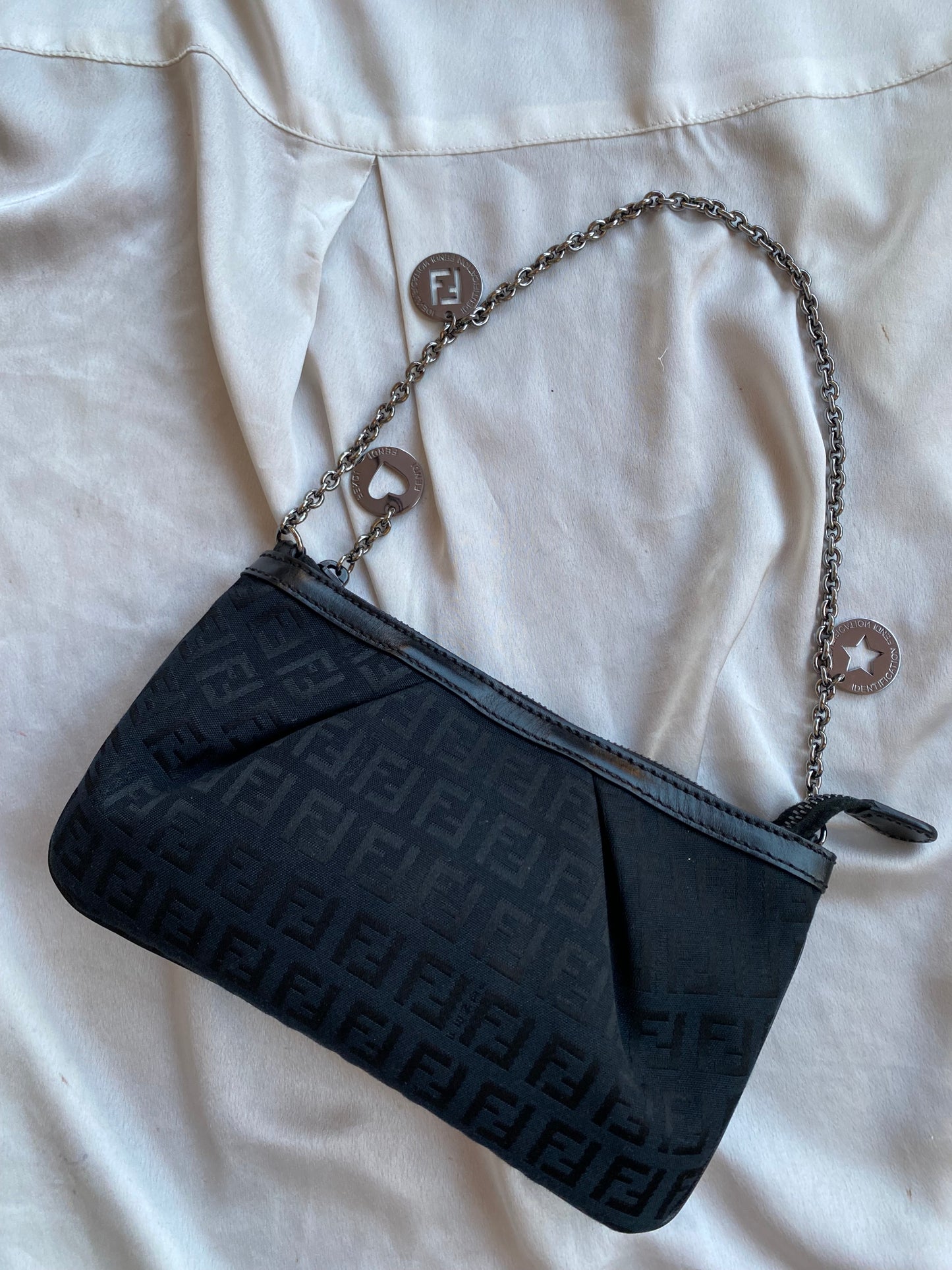 Fendi clutch bag with silver monogram charms and zucchini