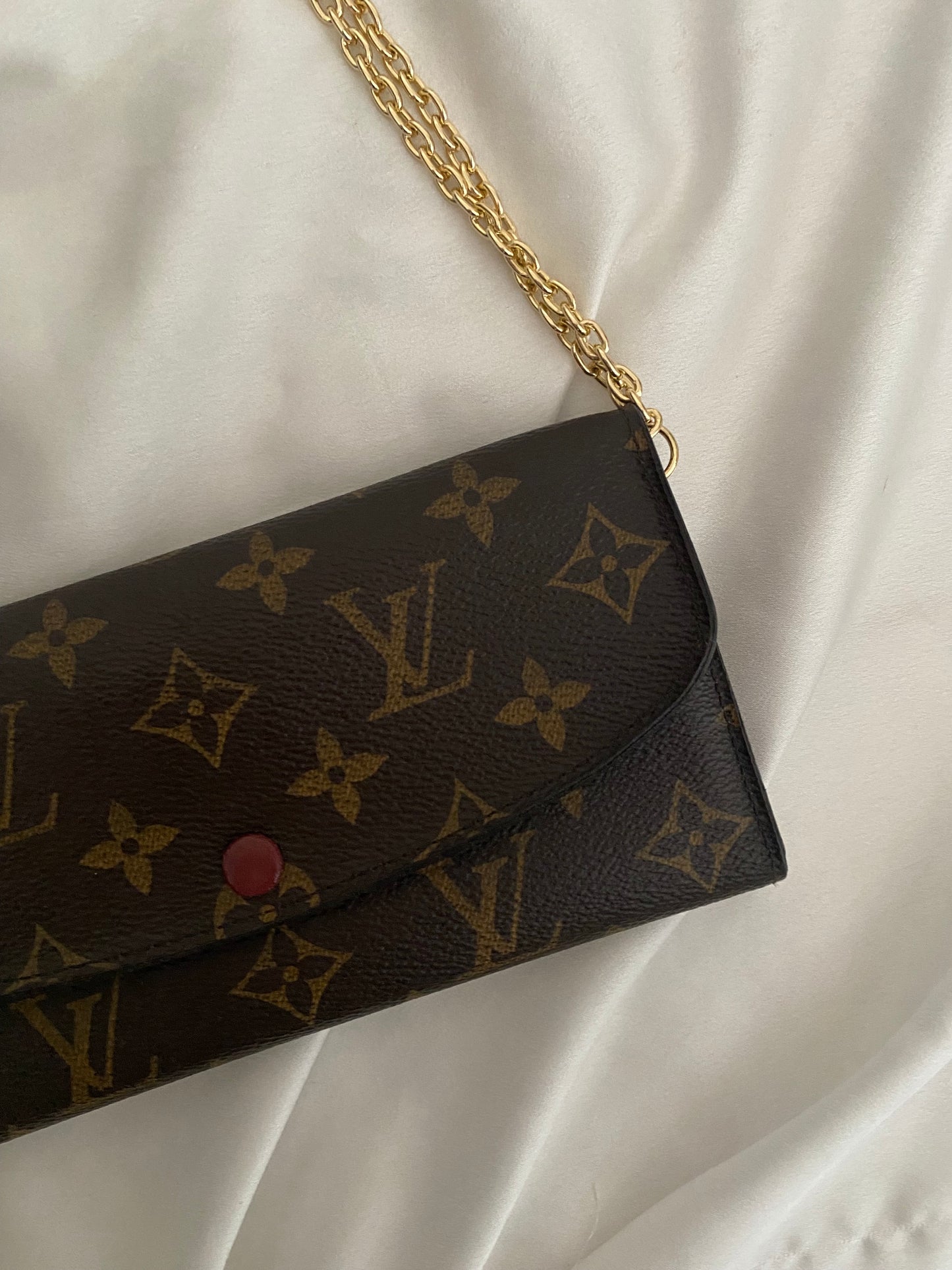 Louis Vuitton Emilie clutch bag with fuchsia interior