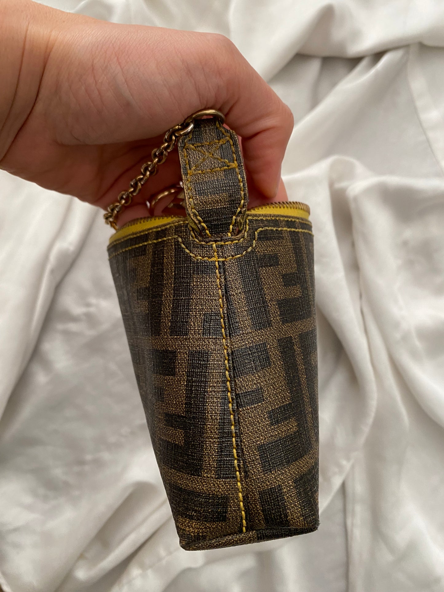 Fendi monogram clutch bag in pumpkin, tobacco, and yellow
