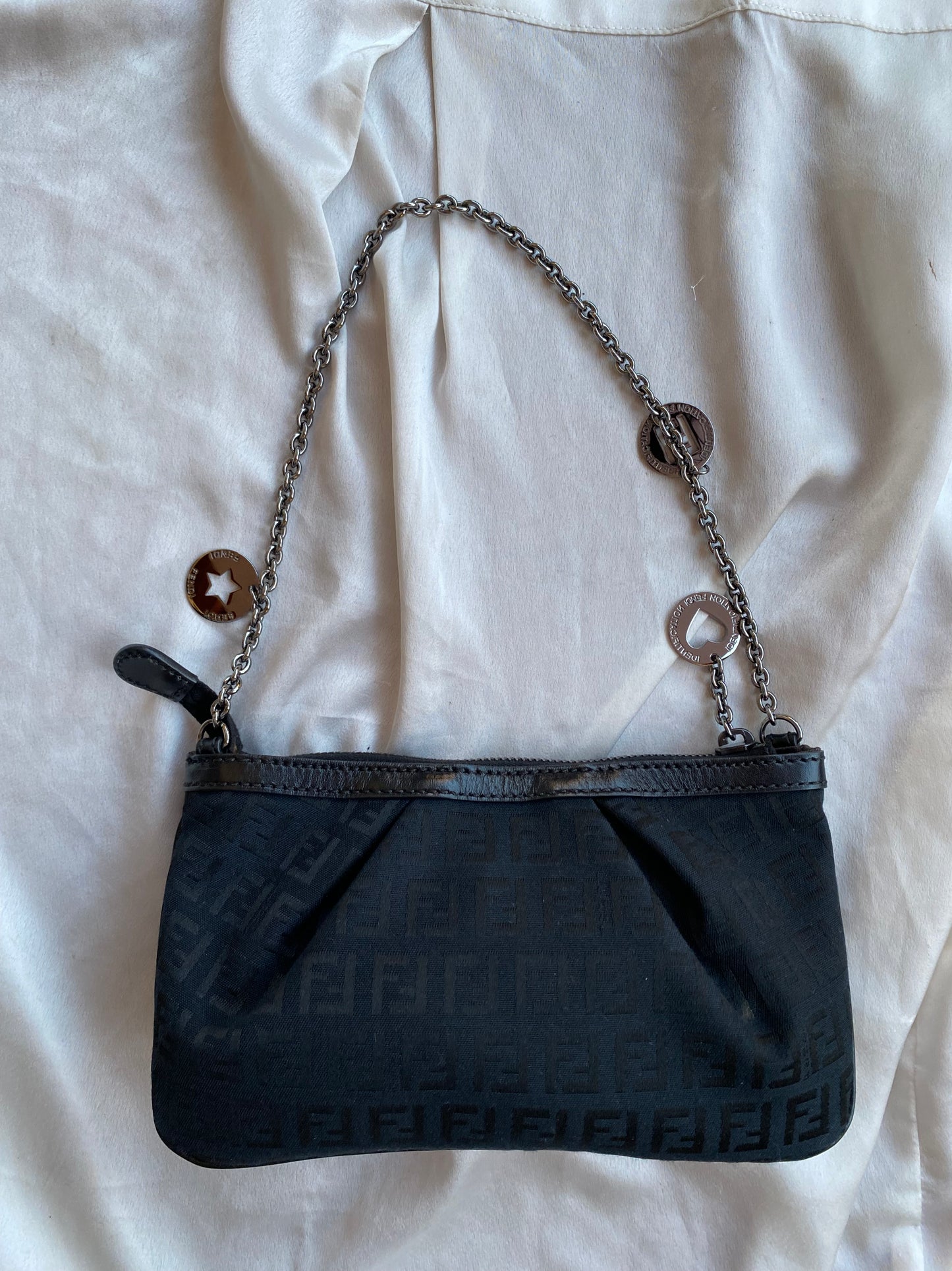 Fendi clutch bag with silver monogram charms and zucchini