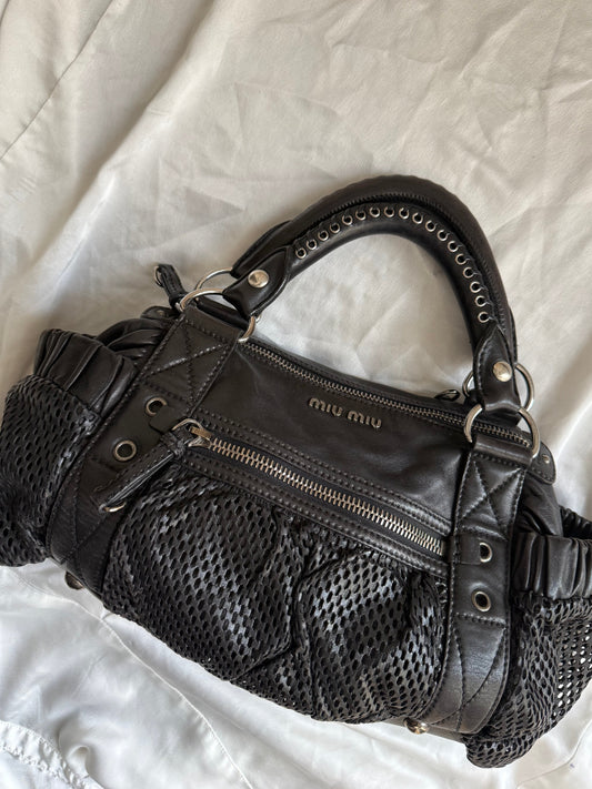 Miu Miu pelle perforata nera