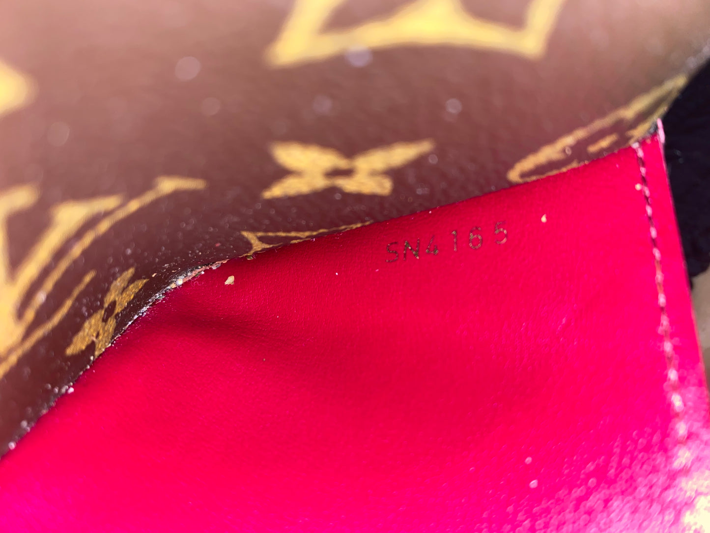 Louis Vuitton Emilie clutch bag with fuchsia interior