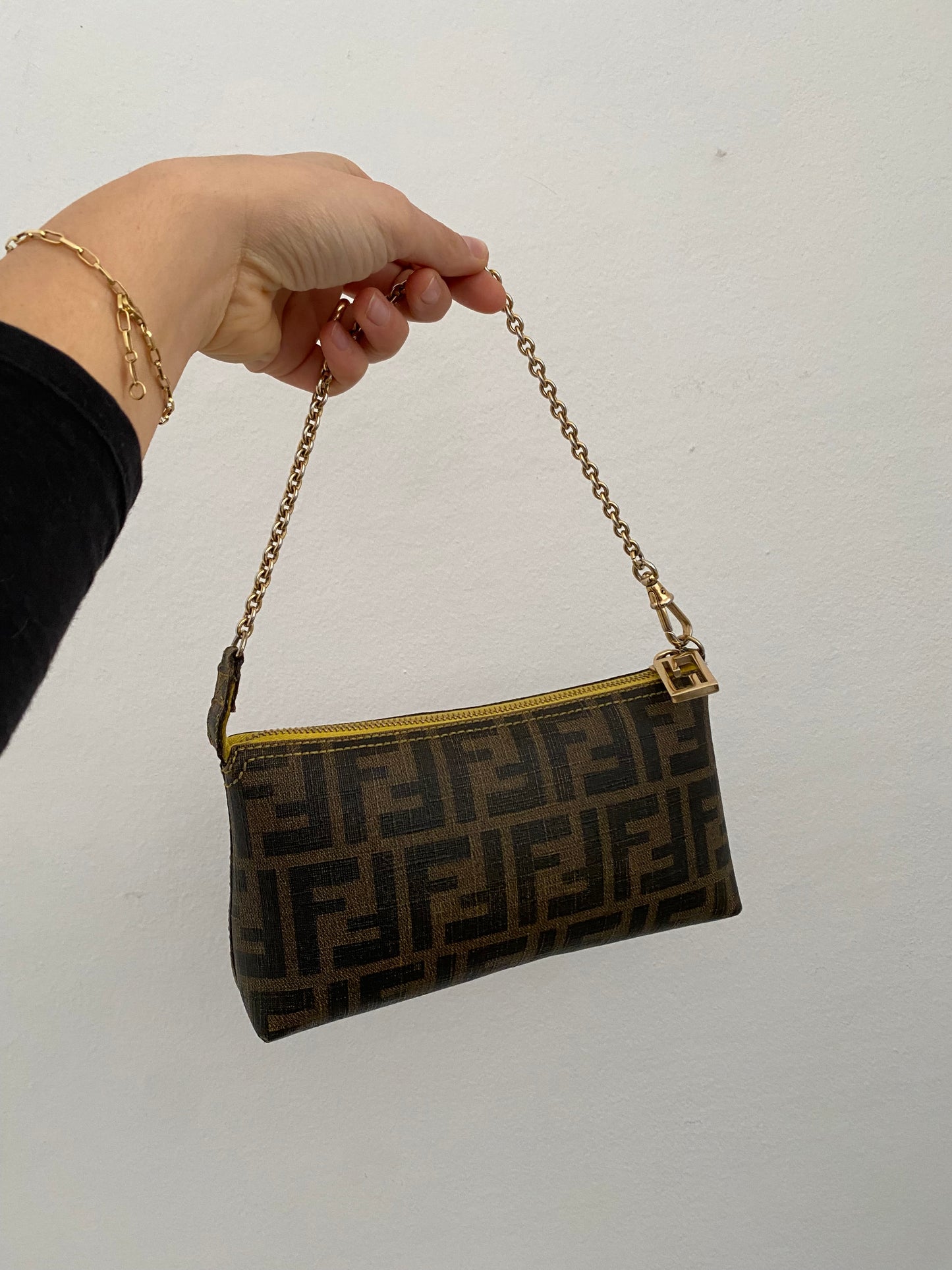 Fendi monogram clutch bag in pumpkin, tobacco, and yellow