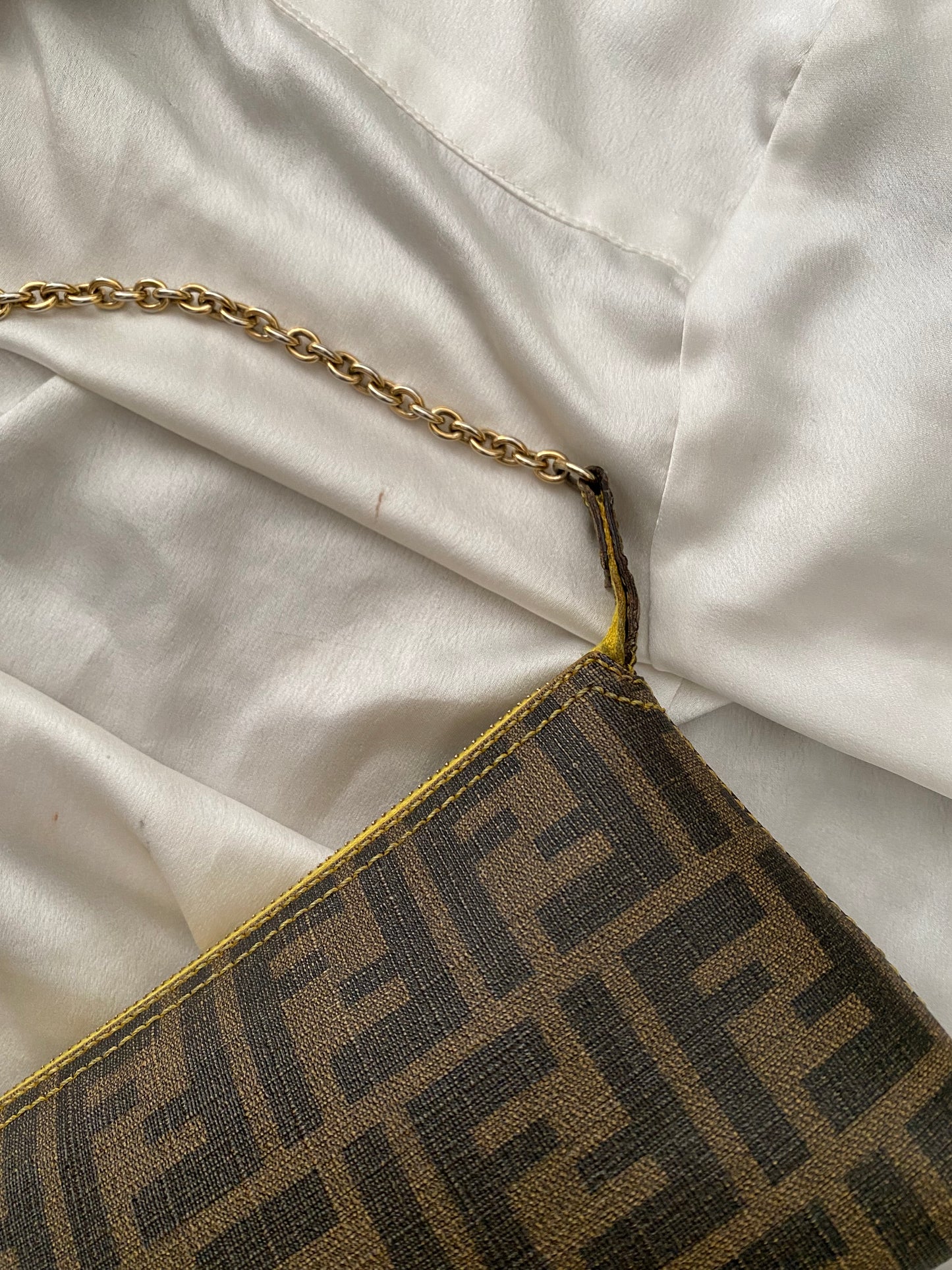 Fendi monogram clutch bag in pumpkin, tobacco, and yellow