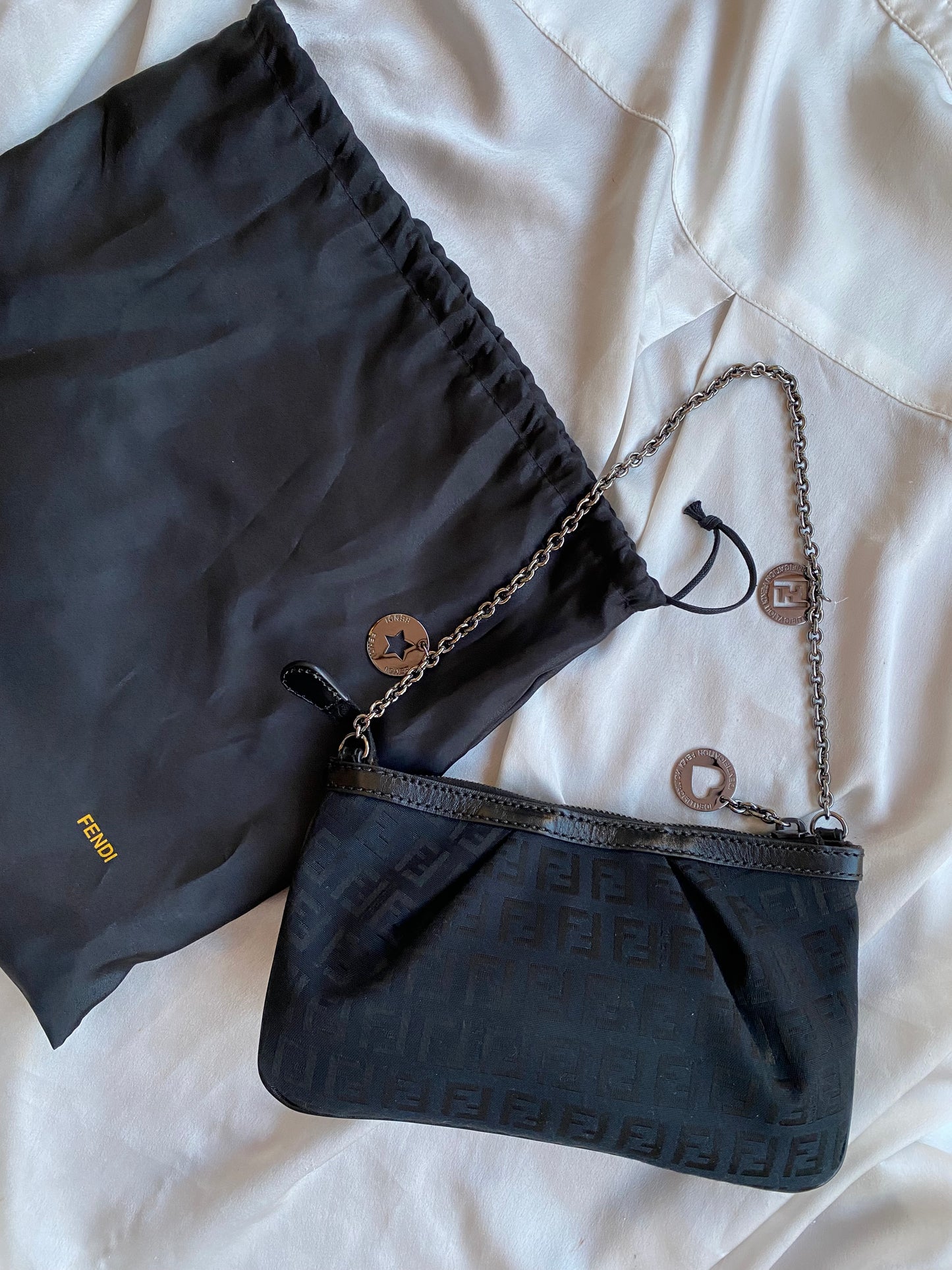 Fendi clutch bag with silver monogram charms and zucchini
