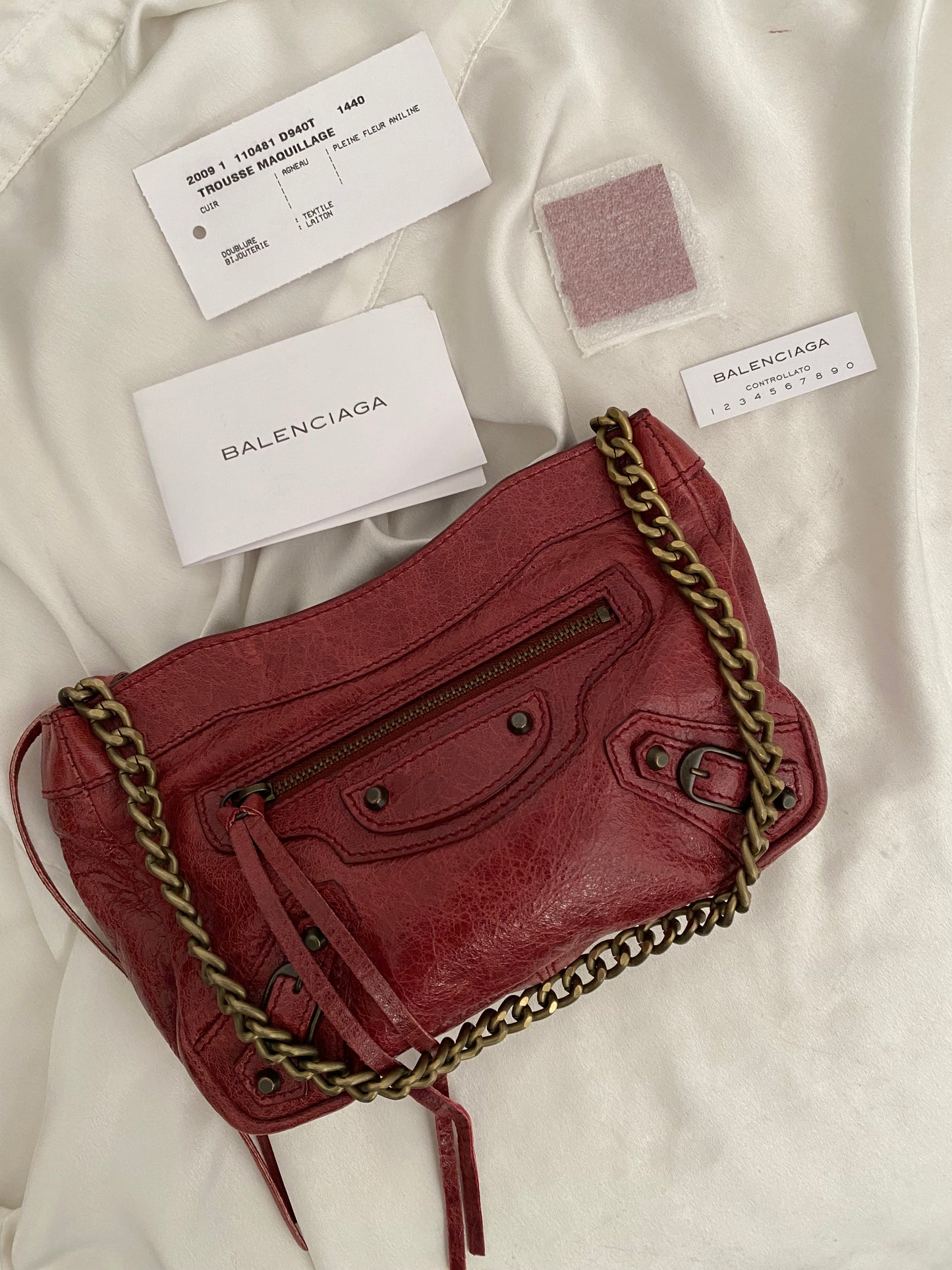 Balenciaga motocross burgundy clutch bag