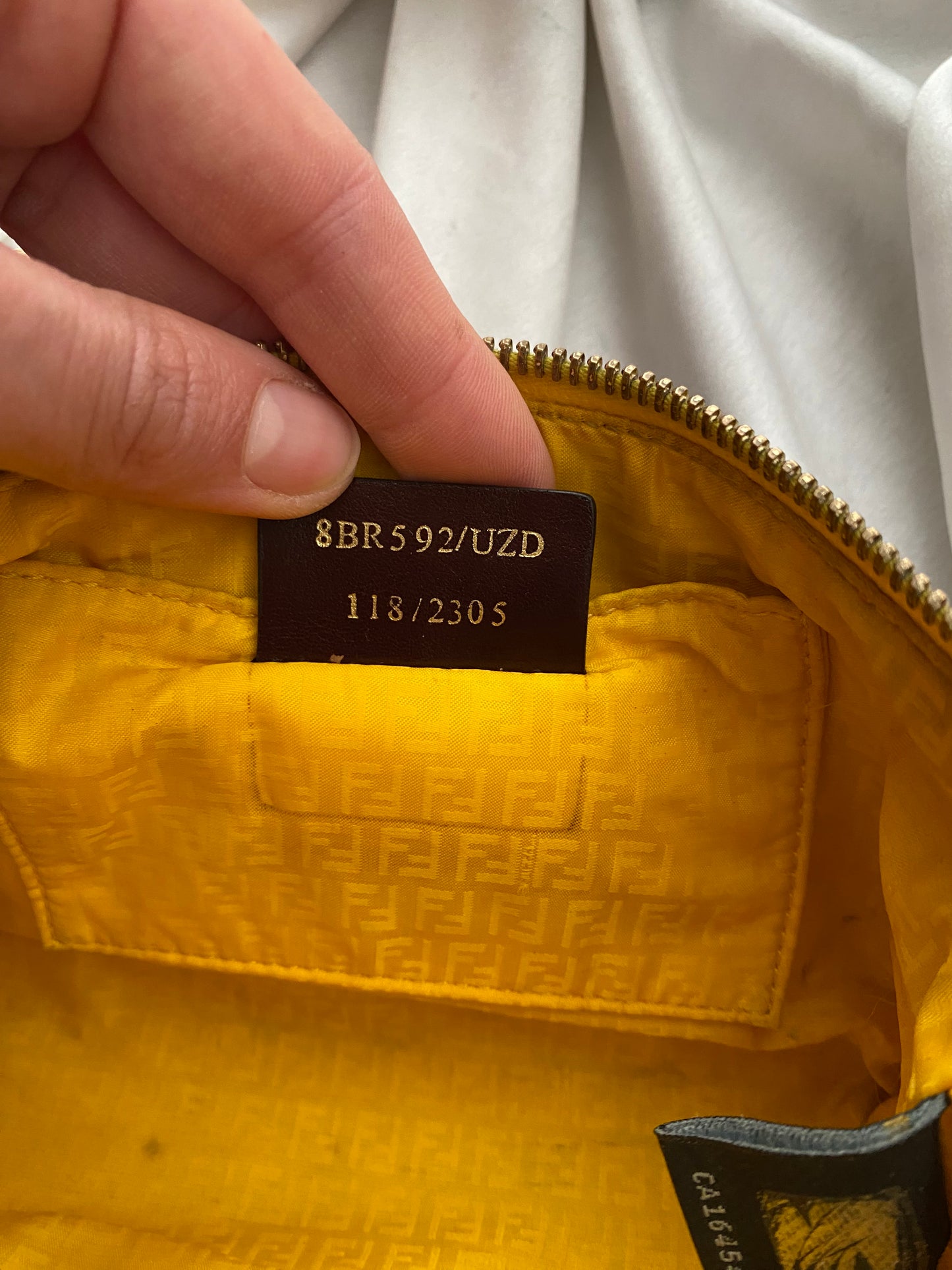 Fendi monogram clutch bag in pumpkin, tobacco, and yellow