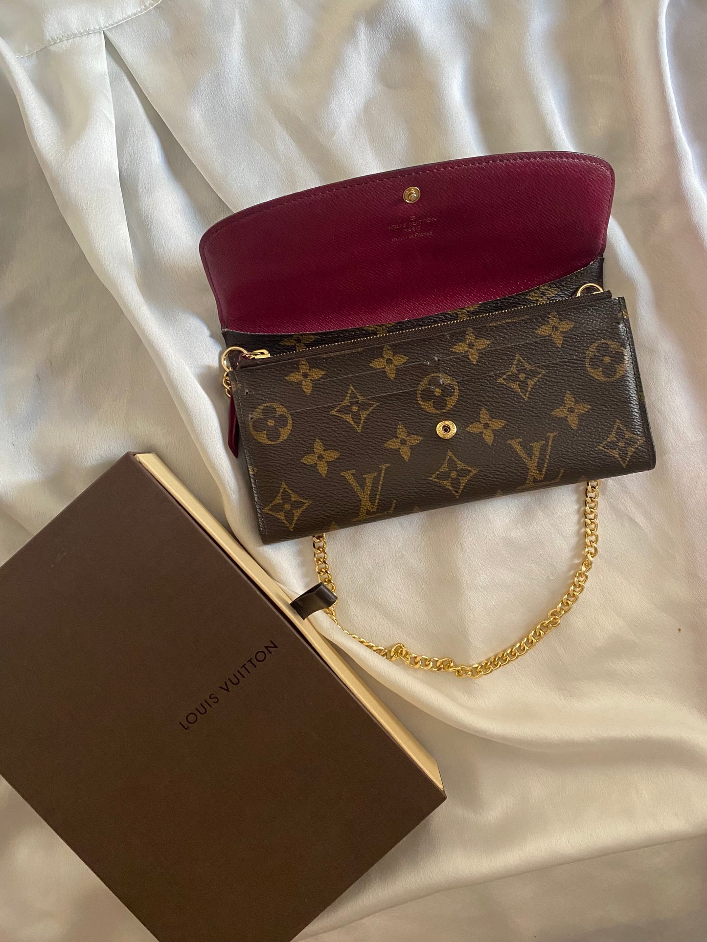 Louis Vuitton Emilie clutch bag with fuchsia interior