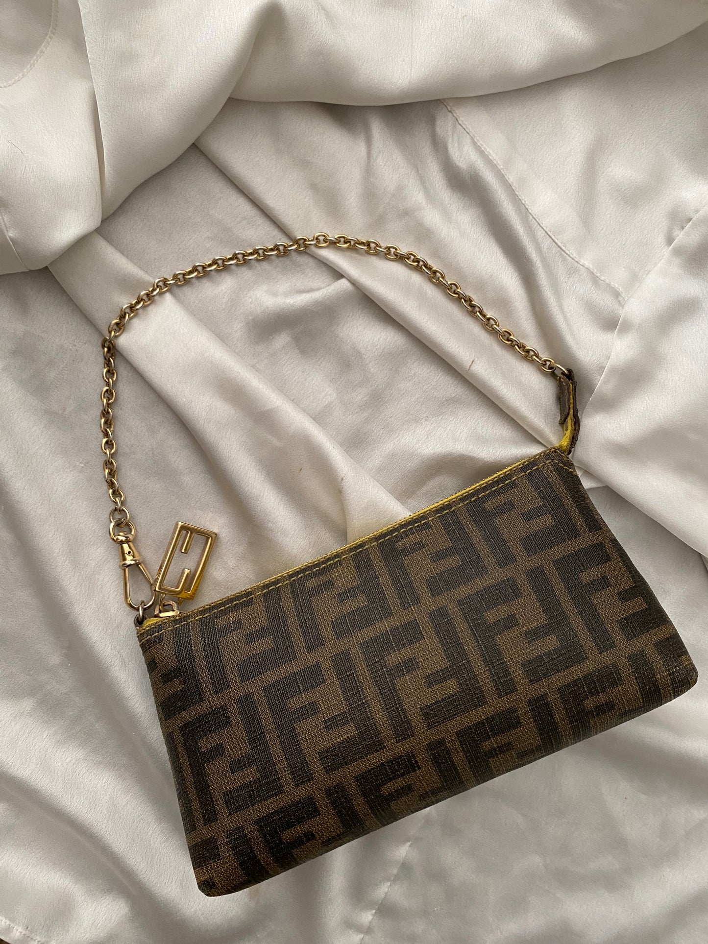 Fendi monogram clutch bag in pumpkin, tobacco, and yellow
