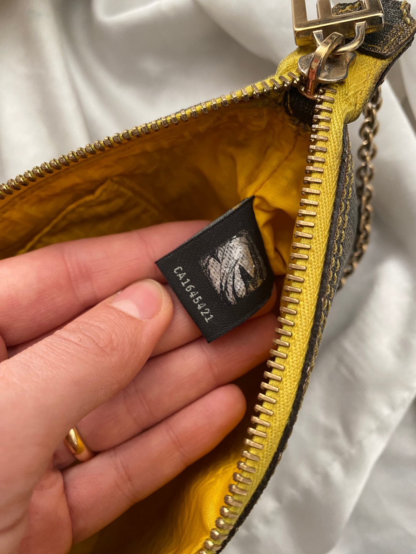 Fendi monogram clutch bag in pumpkin, tobacco, and yellow