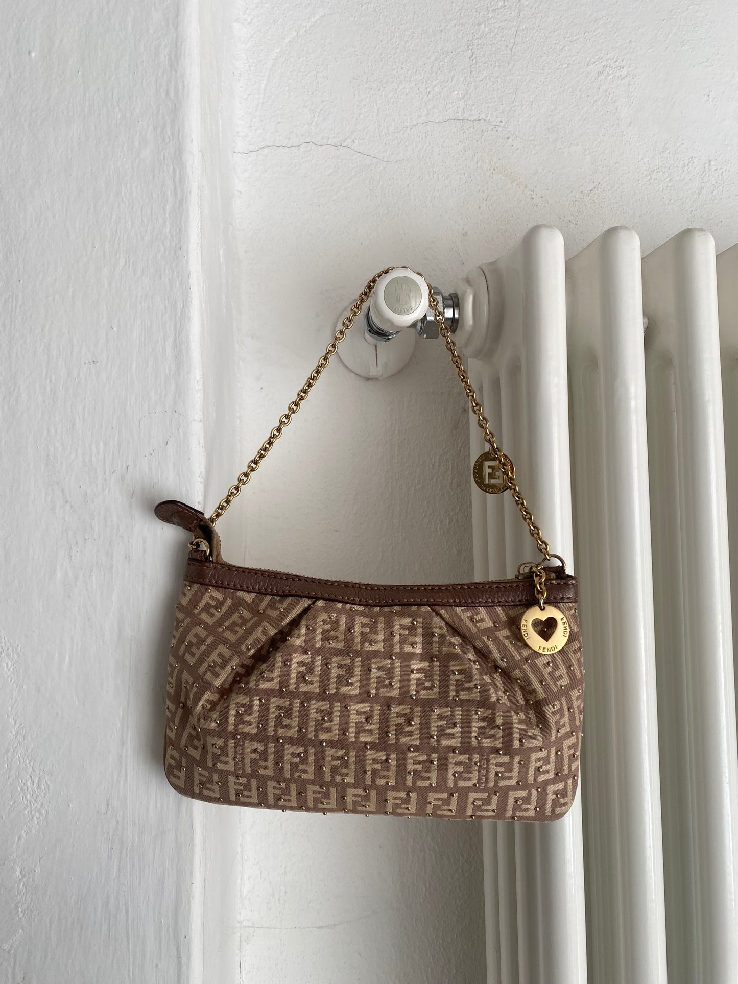Fendi clutch bag with gold charms and beige zucchini monogram