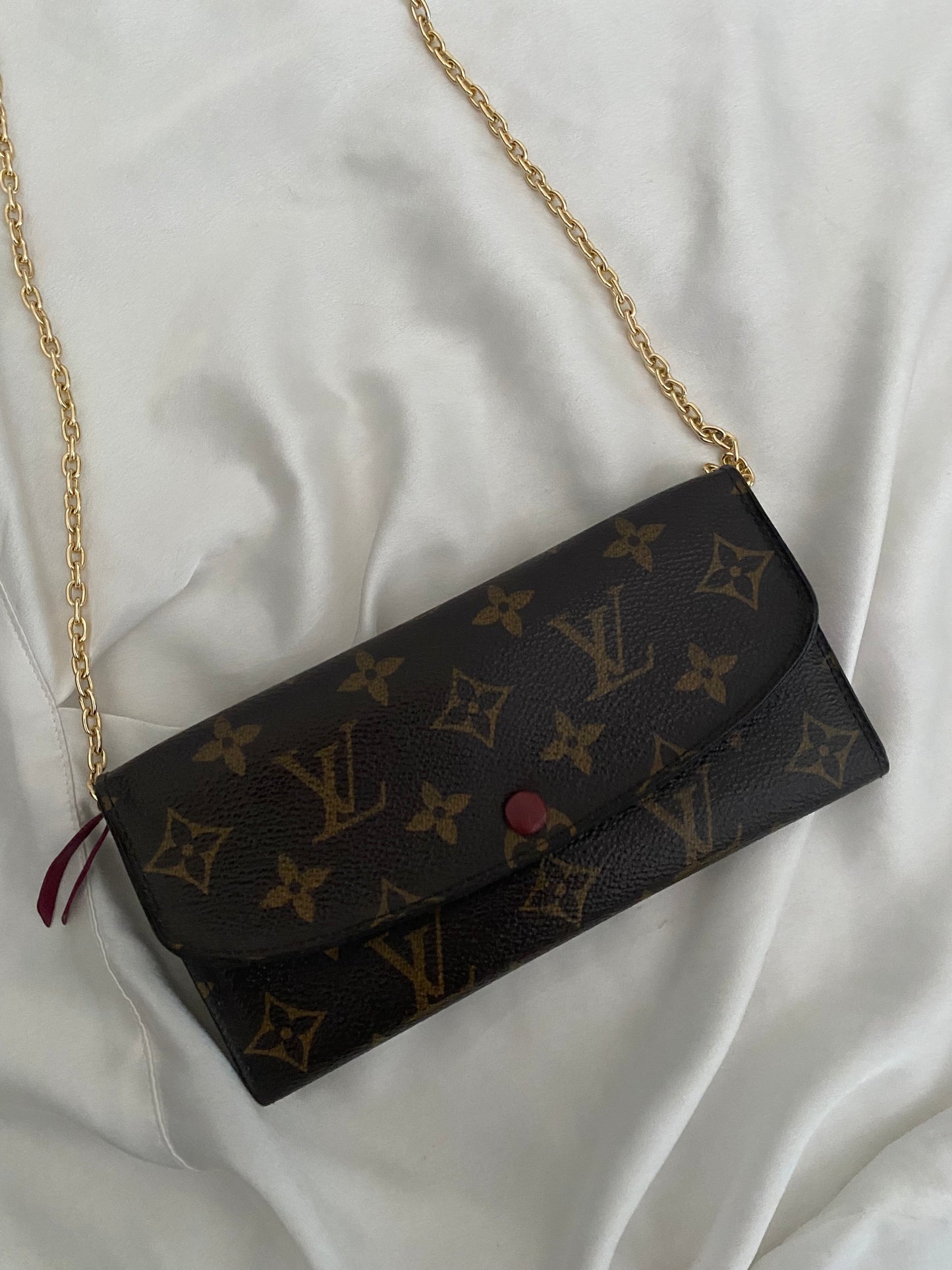 Louis Vuitton Emilie clutch bag with fuchsia interior