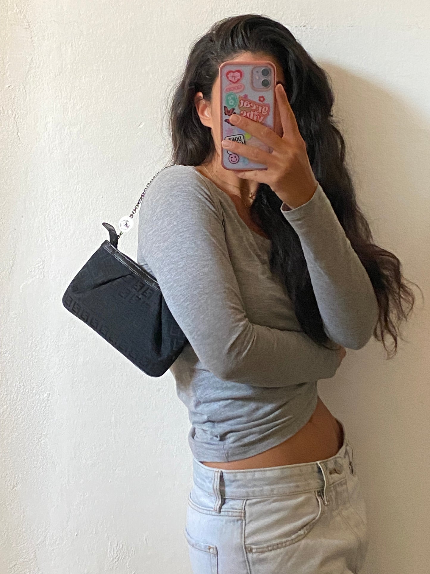 Fendi clutch bag with silver monogram charms and zucchini