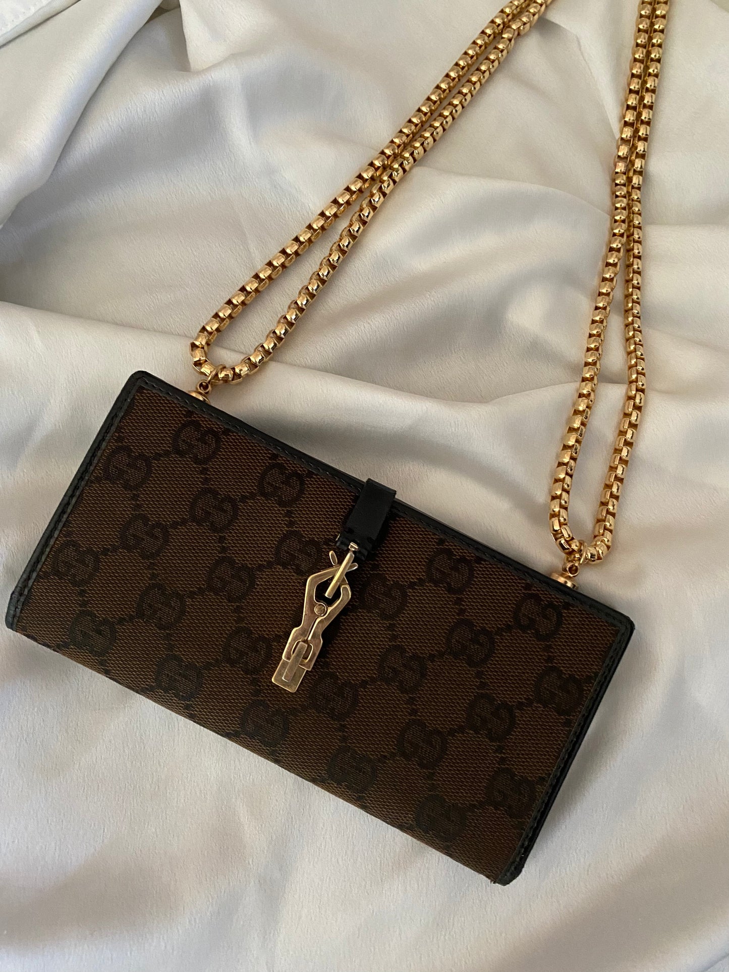 Gucci Monogram brown clutch bag