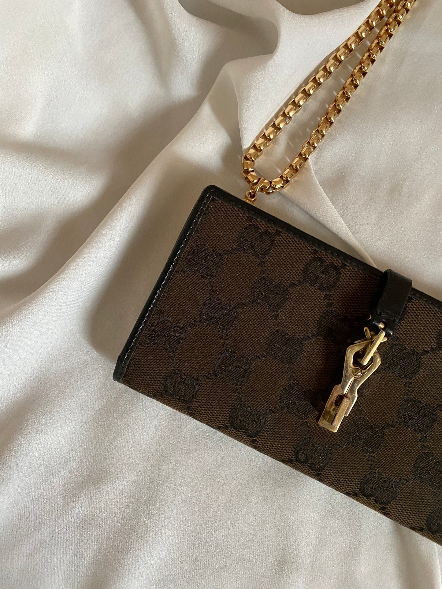Gucci Monogram brown clutch bag