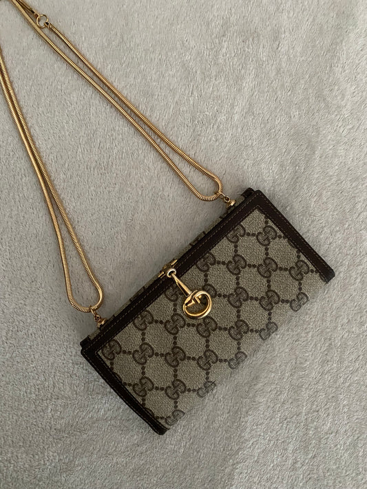 Gucci Monogram clutch bag
