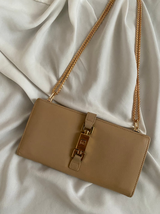 Gucci monogram clutch bag in sand