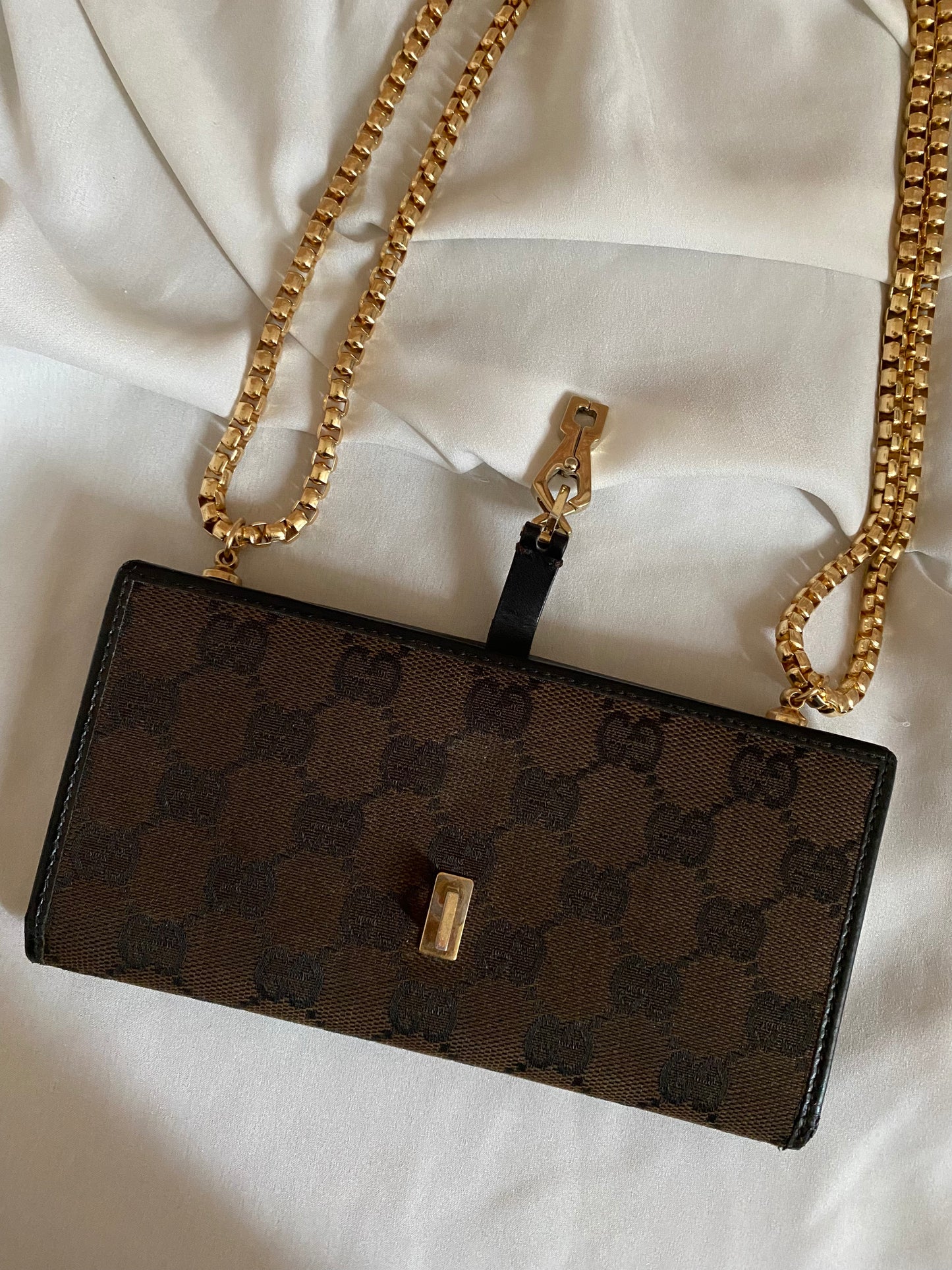 Gucci Monogram brown clutch bag