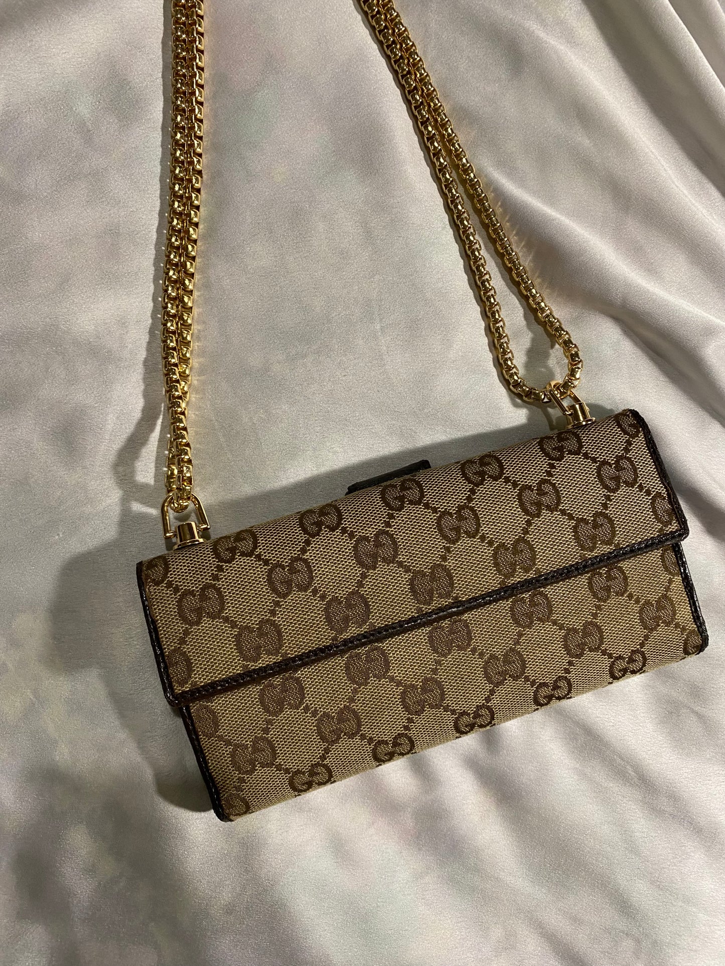 Gucci classic monogram clutch bag